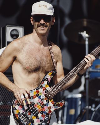 Tony Levin performing onstage with an earlier version of his Funk Fingers, in 1991