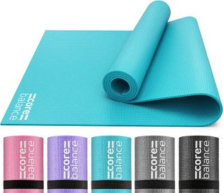 Core balance yoga mat in turquoise partially rolled up