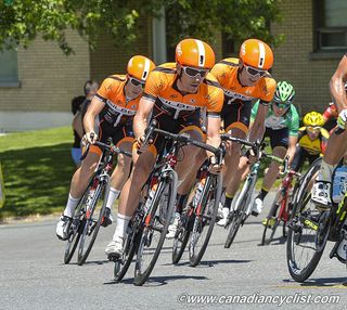 The Silber Pro Cycling team is hard to miss in its orange kit