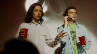 Rory Culkin and Erik Knudsen looking at a crowd in Scream 4.