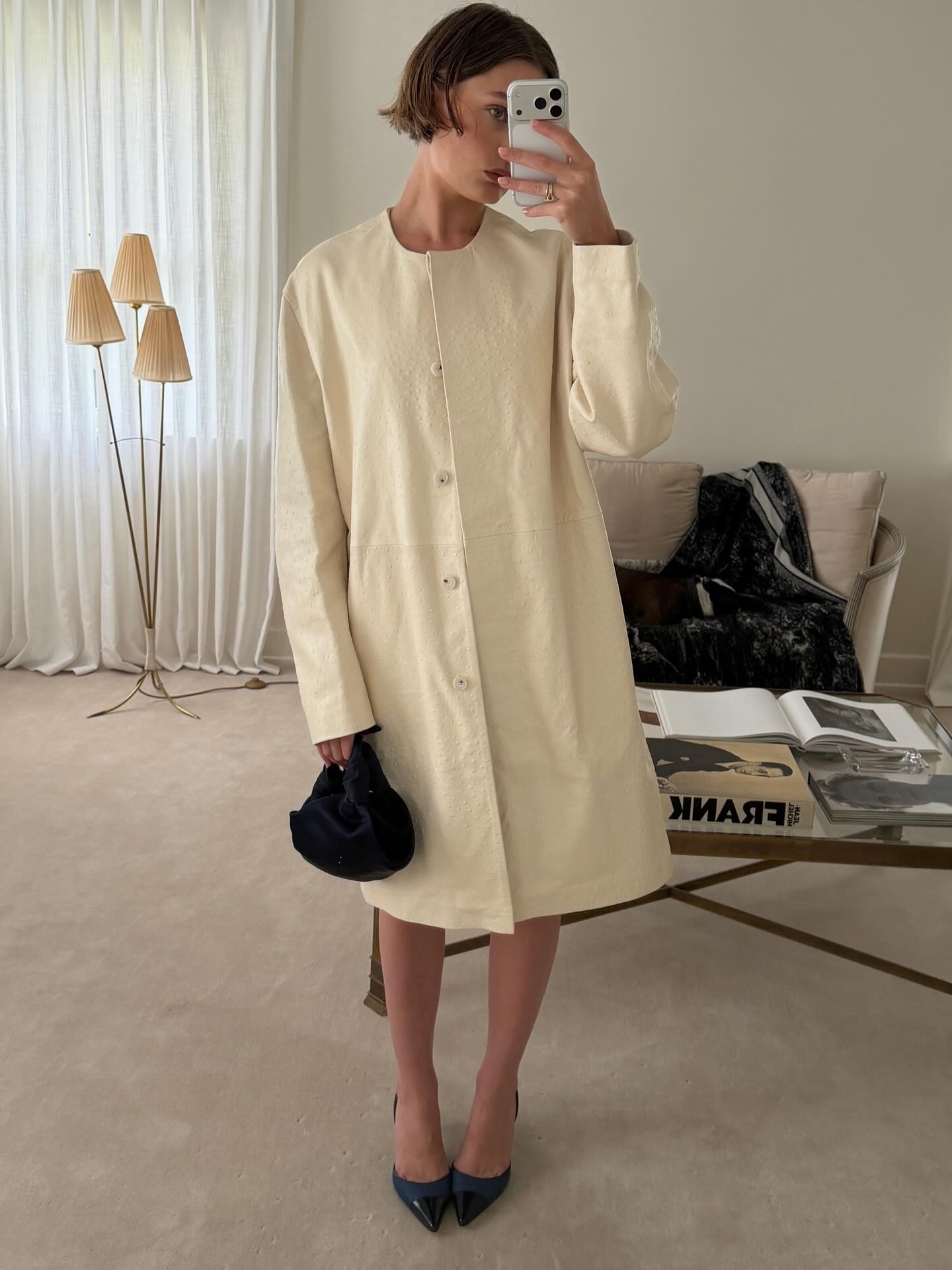 An image of @christietyler wearing an opera coat, one of the biggest spring trends of 2026.