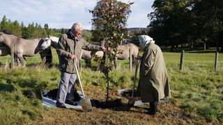 Balmoral's 20k refurbishment: CRATHIE, UNITED KINGDOM - OCTOBER 1: Queen Elizabeth II and Prince Charles, Prince of Wales (known as the Duke of Rothesay when in Scotland) plant a tree at the Balmoral Cricket Pavilion, to mark the start of the official planting season for the Queen's Green Canopy (QGC), on October 1, 2021 near Crathie, Scotland. The QGC is a UK-wide Platinum Jubilee initiative which will create a lasting legacy in tribute to the Queen's 70 years of service to the nation, through a network of trees planted in her name.
