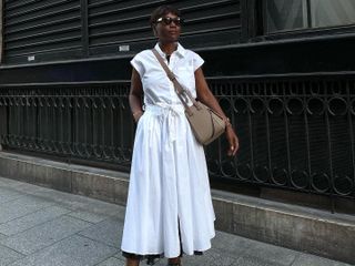 French woman wears a white cotton poplin shirt dress.