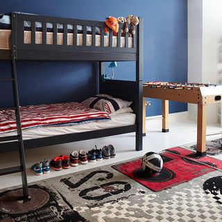 childrens room with double bed and shoes with cosy carpet on floor