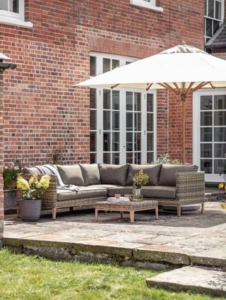 rustic stone patio with parasol
