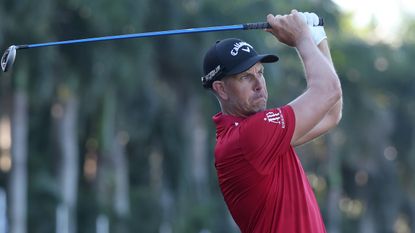 Henrik Stenson hits a fairway wood