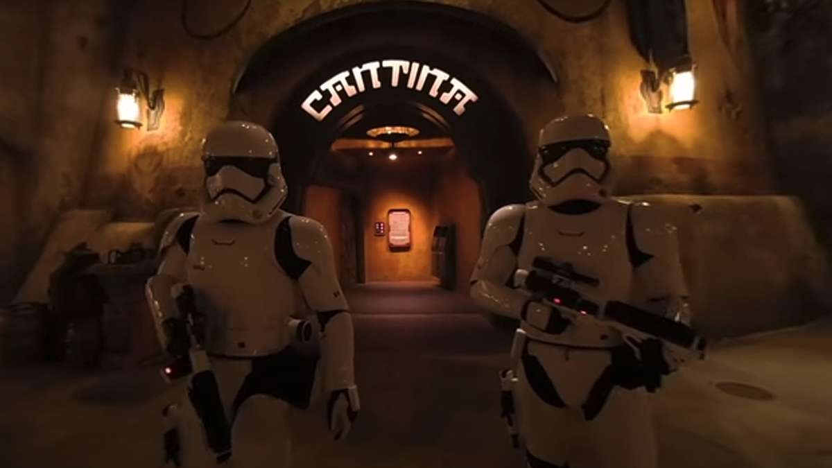 Two stormtroopers stand outside of Oga&#039;s Cantina at Disneyland. 