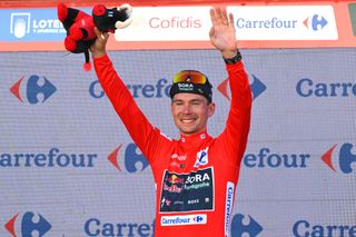 SEVILLE SPAIN AUGUST 21 Primoz Roglic of Slovenia and Team Red Bull Bora hansgrohe Red Leader Jersey celebrates at podium during La Vuelta 79th Tour of Spain 2024 Stage 5 a 177km stage Fuente del Maestre to Seville UCIWT on August 21 2024 in Seville Spain Photo by Tim de WaeleGetty Images