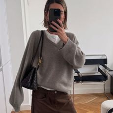 woman in gray sweater