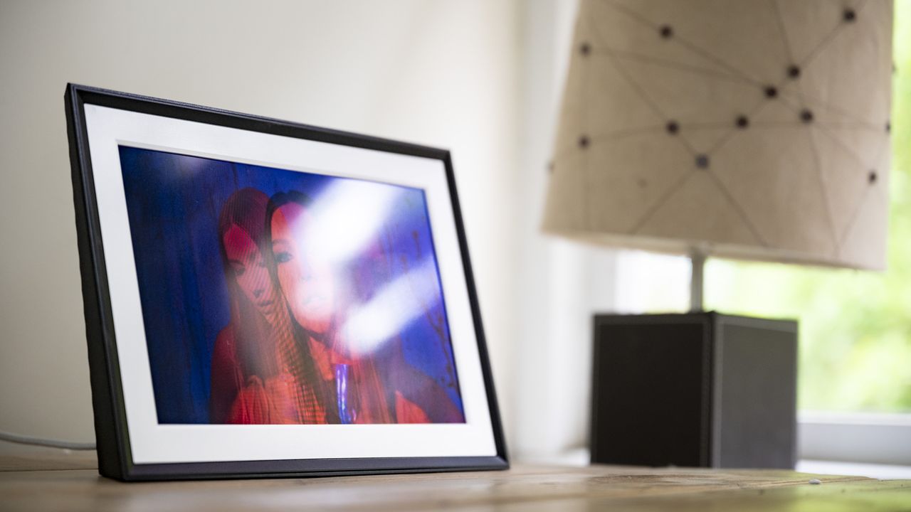 Reflections in the Aura Carver Mat digital frame's screen