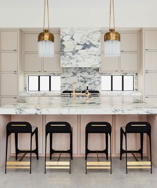 Pink kitchen ideas with marble countertop and backsplash
