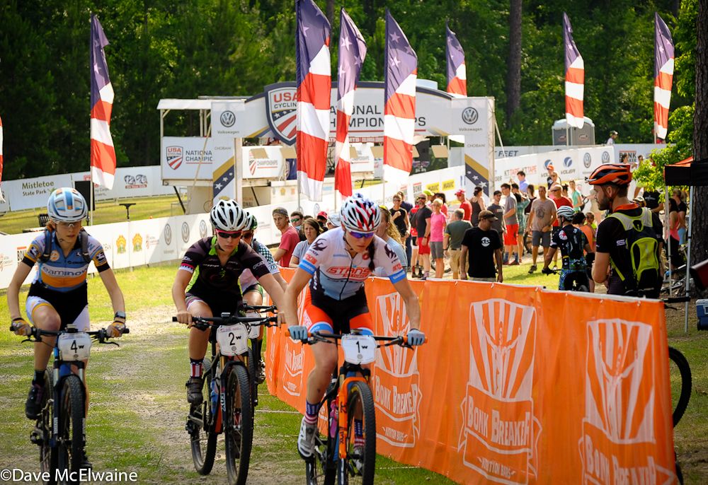 Rose Grant (Stans NoTubes-Pivot) leading the Elite Women out onto the course.