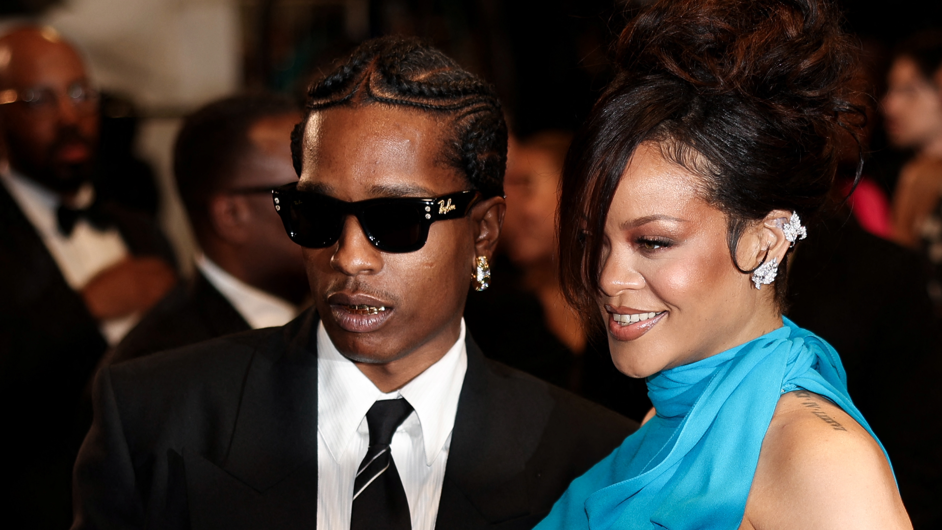 Barbadian singer and actress Rihanna and US actor and singer Asap Rocky leave after the screening of the film "Highest 2 Lowest" at the 78th edition of the Cannes Film Festival in Cannes, southern France, on May 19, 2025. (Photo by Sameer Al-Doumy / AFP) (Photo by SAMEER AL-DOUMY/AFP via Getty Images)