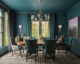 Modern dining room painted teal on walls and ceiling