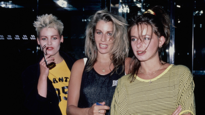 1980s fashion: Bananarama attending an event in New York City wearing yellow and black tops with tousled hair 