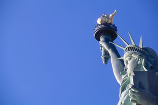 picture of the Statue of Liberty against the sky backdrop