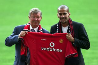 Sir Alex Ferguson poses alongside new Manchester United signing Juan Sebastian Veron in July 2001.