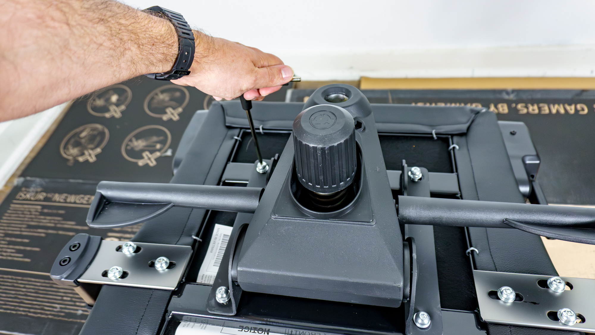 A person building the Razer Iskur V2 NewGen gaming chair