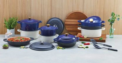 Aldi cast iron cookware collection a kitchen with a wooden wall