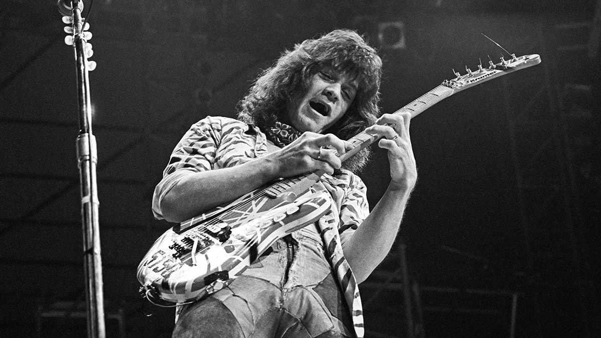 Please keep both hands on the fretboard at all times: Eddie Van Halen takes a solo live onstage in 1984
