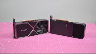 The Nvidia RTX 4070 and RTX 3070 pictured side-by-side on a pink worksurface.