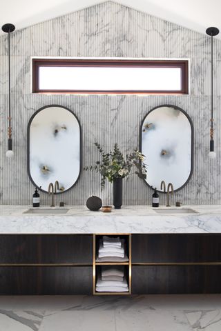 small bathroom with marble countertop by K Interiors