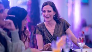 Catherine MacDiarmid (Lara Pulver) smiling on a night out