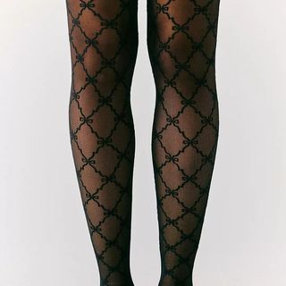 lace patterned tights with bow details from Free People