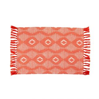 rug with red and orange coloured pattern