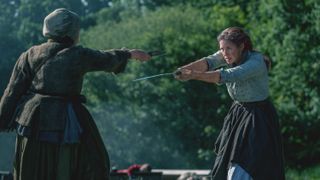 Claire Fraser fends off a woman in Outlander season 7 episode 8