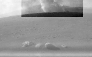 This image from one of the rear Hazard Cameras, or Hazcams, aboard NASA's Perseverance Mars rover, shows a smoke plume from the crashed descent stage that lowered the rover to the Martian surface. This image was taken within a minute or two after the rover landed on February 18, 2021.