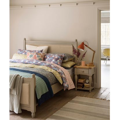 bedroom with wooden flooring and cushion