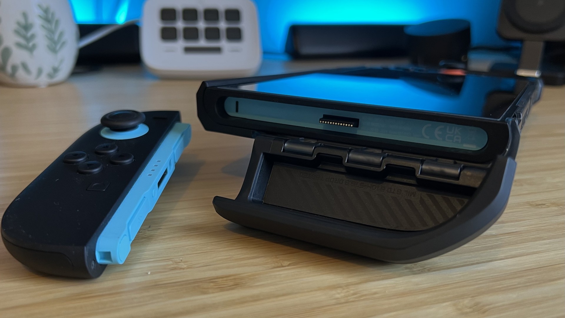 Close up on the open hinge of the SupCase Unicorn Beetle Pro Joy-Con compartment with the controller removed from the Nintendo Switch 2