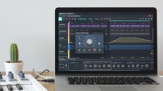 Soundation being used on a laptop next to a MIDI controller