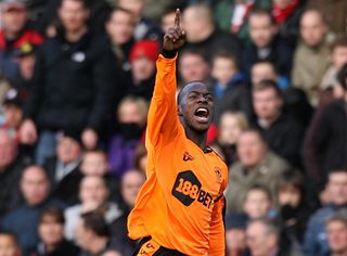 Maynor Figueroa celebrates after scoring a free-kick from his own half for Wigan Athletic against Stoke City, 2009