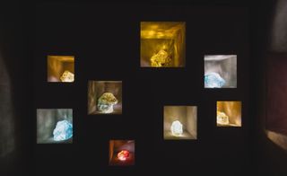 illuminated rocks in cubby hole display