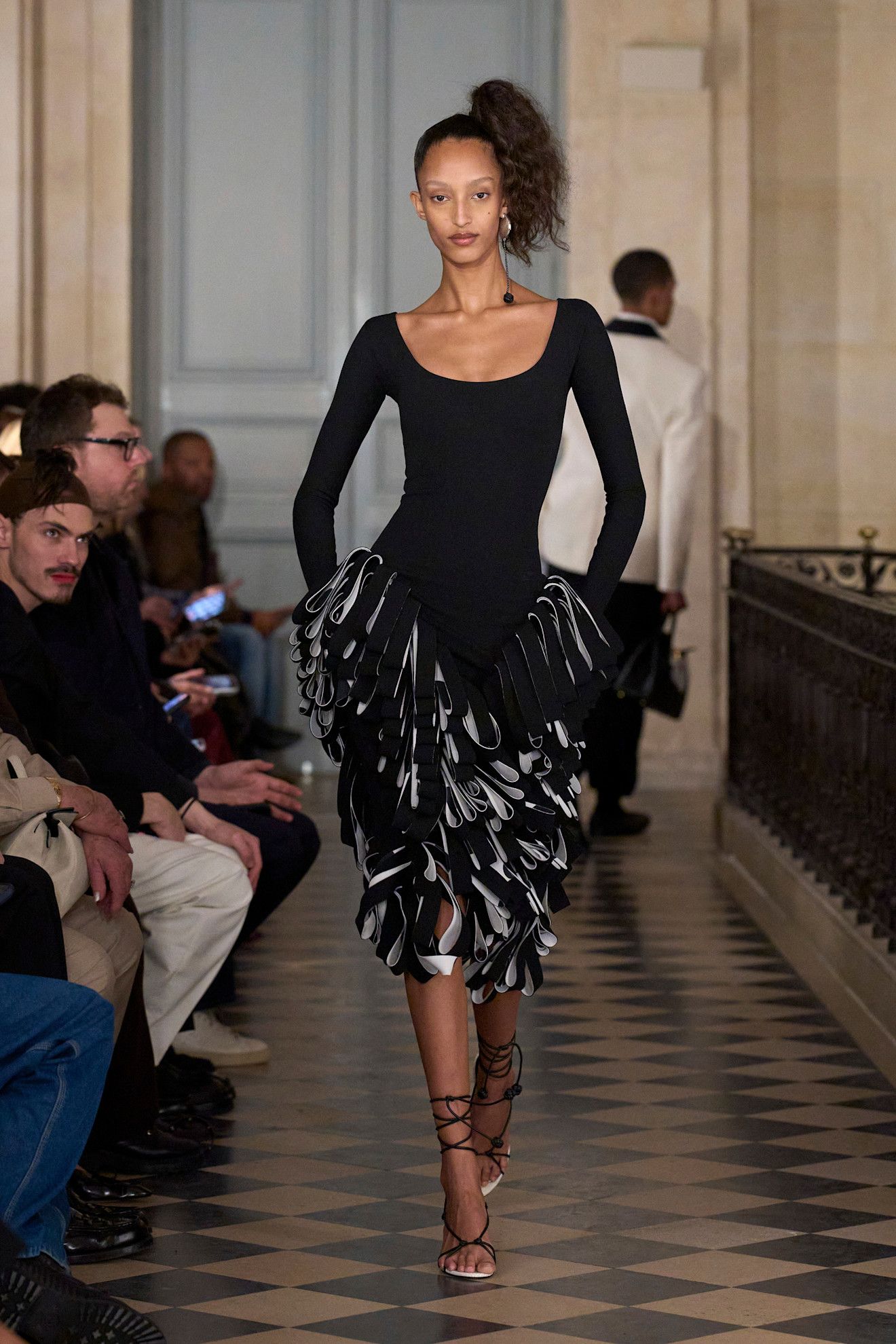 Photos of models at Paris Fashion Week Fall Winter 2026 wearing basque waist trend.