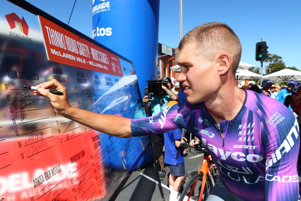 ADELAIDE, AUSTRALIA - JANUARY 25: Luke Plapp of Australia and Team Jayco AlUla signing on before the 25th Santos Tour Down Under Think! Road Safety Men&#039;s Stage 5 from McLaren Vale to Willunga Hill on January 25, 2025 in Adelaide, Australia. (Photo by Peter Mundy/Getty Images)