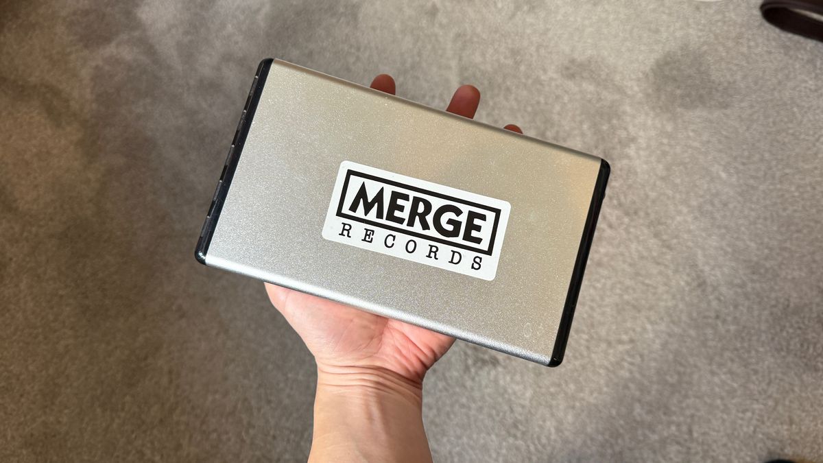 An old external hard drive in hand.