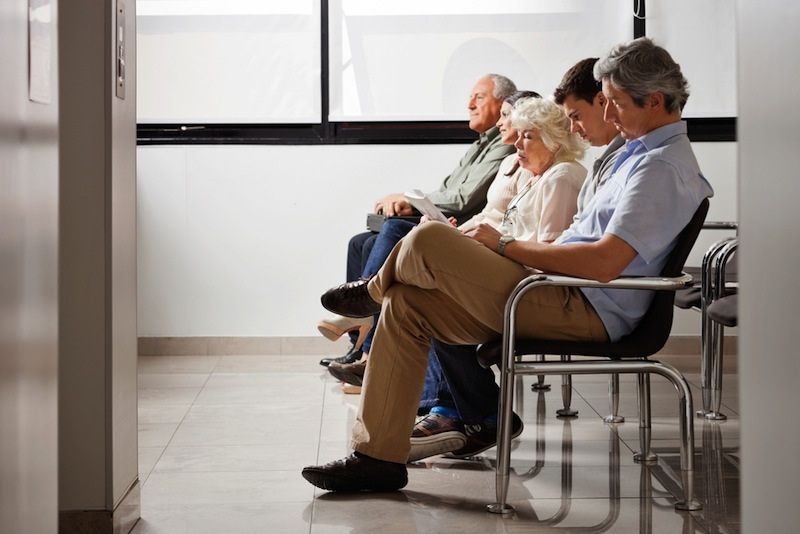 A number of people in the hospital&#039;s waiting room.