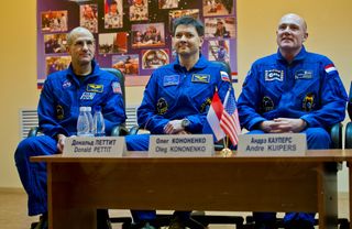 Expedition 30 crew members, from left, Don Pettit of NASA, Oleg Kononenko of Russia, and Andre Kuipers of the Netherlands speak at a press conference in Russia on Tuesday (Dec. 20), just a day before their scheduled launch to the International Space Stati