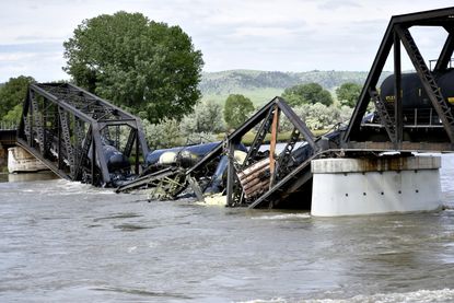 The remains of a derailed train in Montana following a bridge collapse. 