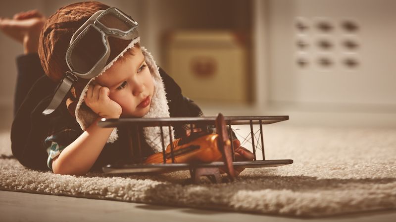 Little boy with toy airplane