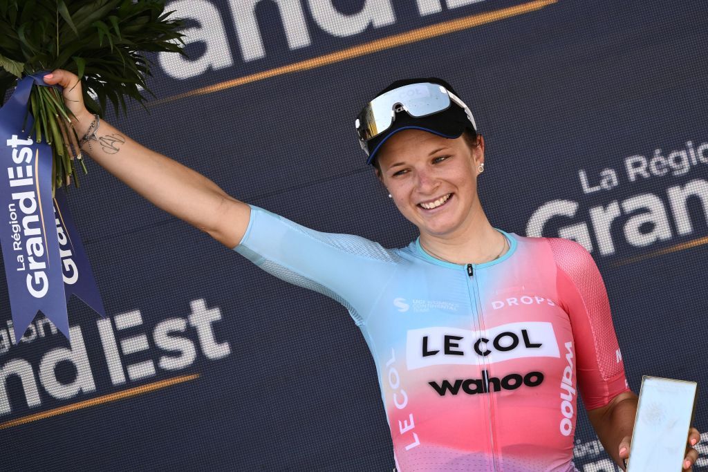 Le ColWahoos team French rider Gladys Verhulst celebrates her most competitive rider prize at the end of the 1st stage of the new edition of the Womens Tour de France cycling race 816 km between the Tour Eiffel and the ChampsElysees in Paris on July 24 2022 Photo by Jeff PACHOUD AFP Photo by JEFF PACHOUDAFP via Getty Images