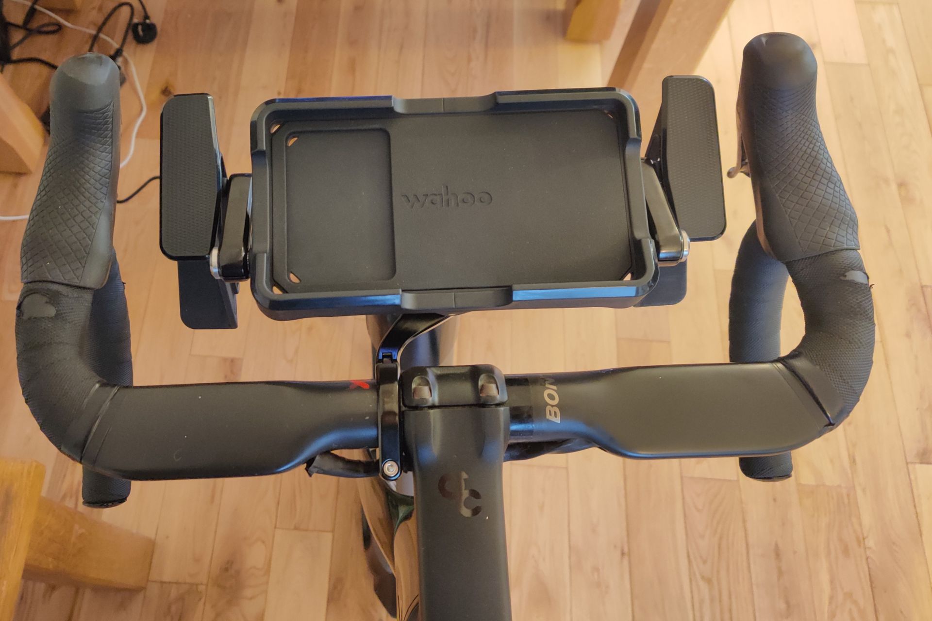 Image shows a rider using Wahoo's new Kickr Steer on the updated RGT cycling platform