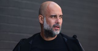 Manchester City manager Pep Guardiola looks on prior to the Premier League match between Burnley FC and Manchester City at Turf Moor on August 11, 2023 in Burnley, England.