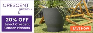 Grass growing in a container next to a lounge chair. A call to action says 20% off select crescent garden planters