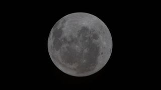 The Artemis 2 crew took this photo on April 4, 2026, Day 4 of their journey to the moon. The moon is oriented with the south pole at the top. Orientale Basin is on the right edge of the lunar disk in this image. Artemis 2 marks the first time that humans have seen the entire basin. The astronauts will continue to observe Orientale from multiple angles as they approach the moon and throughout the lunar flyby. Orientale is the textbook multi-ring impact basin used as a baseline to compare other impact craters on rocky worlds from Mercury to Pluto.