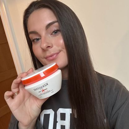 Tori holding the Kérastase Nutritive Masquintense Riche Deep Nutrition Rich Mask