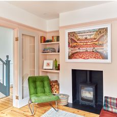 pale pink living room with burner and armcchair